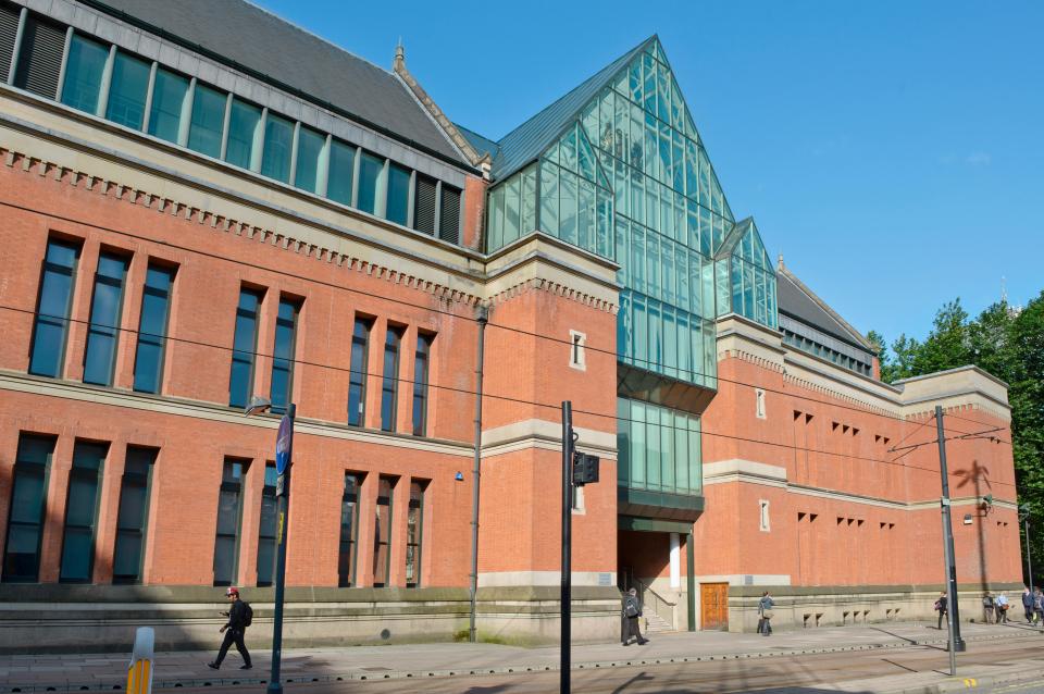 The entrance to Minshull Street Crown Court (or City Police Courts) in Manchester on a sunny day.