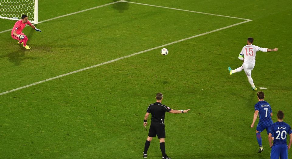 Spain captain Sergio Ramos side-foots his penalty kick down the middle of the goal 
