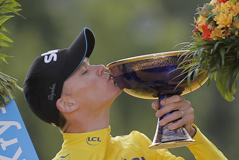 Chris Froome with the winners trophy at the 2015 Tour de France