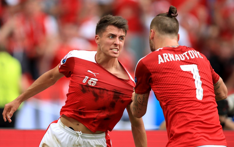 Goalscorer is congratulated by Marko Arnautovic after keeping hopes alive