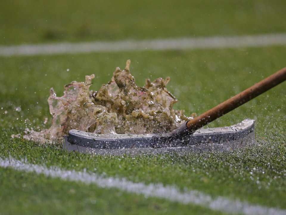 Jun 22, 2016; Chicago, IL, USA; A groundskeeper removes rain from the pitch prior to the second half of a game between Chile and Colombia in the semifinals of the 2016 Copa America Centenario soccer tournament at Soldier Field. Chile defeated Colombia 2-0. Mandatory Credit: Dennis Wierzbicki-USA TODAY Sports