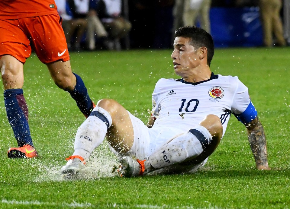 Jun 22, 2016; Chicago, IL, USA; Colombia midfielder James Rodriguez (10) slips on the grass after shooting the ball during the second half in the semifinals of the 2016 Copa America Centenario soccer tournament at Soldier Field. Chile defeated Colombia 2-0. Mandatory Credit: Mike DiNovo-USA TODAY Sports