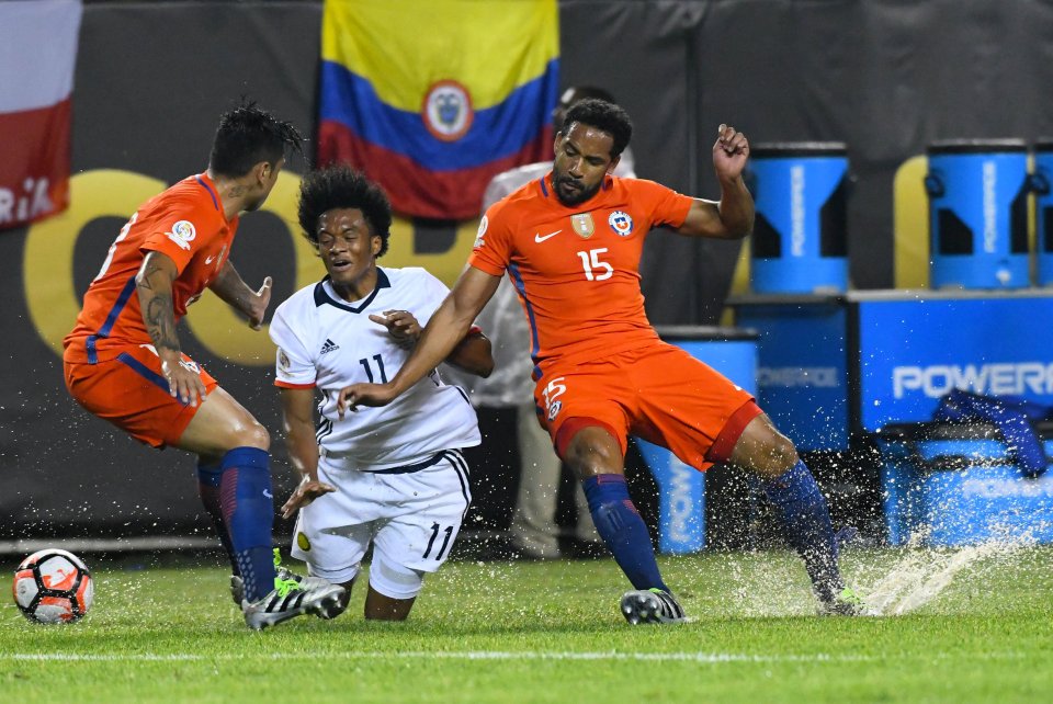 Jun 22, 2016; Chicago, IL, USA; Chile midfielder Jean Beausejour (15) fouls Colombia midfielder Juan Cuadrado (11) during the second half in the semifinals of the 2016 Copa America Centenario soccer tournament at Soldier Field. Chile defeated Colombia 2-0. Mandatory Credit: Mike DiNovo-USA TODAY Sports TPX IMAGES OF THE DAY