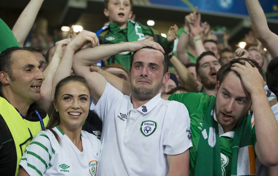 LILLE, FRANCE - JUNE 22: Republic of Ireland Robbie Brady's girlfriend Kerrie Harris (left) and brother (centre) show their emotions at full time of the UEFA Euro 2016 Group E match between Italy and Republic of Ireland at Stade Pierre-Mauroy on June 22 in Lille, France. (Photo by Craig Mercer/CameraSport via Getty Images)