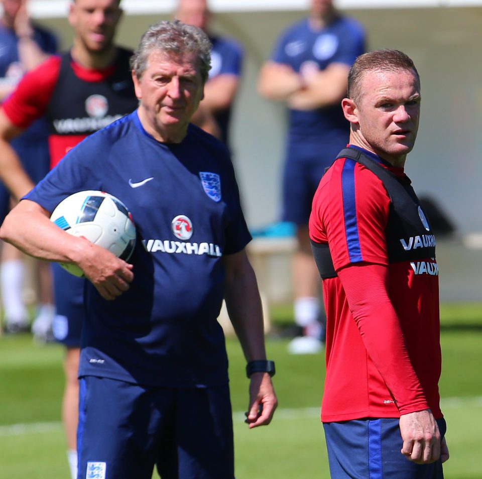 England's coach Roy Hodgson (L) and Wayne Rooney
