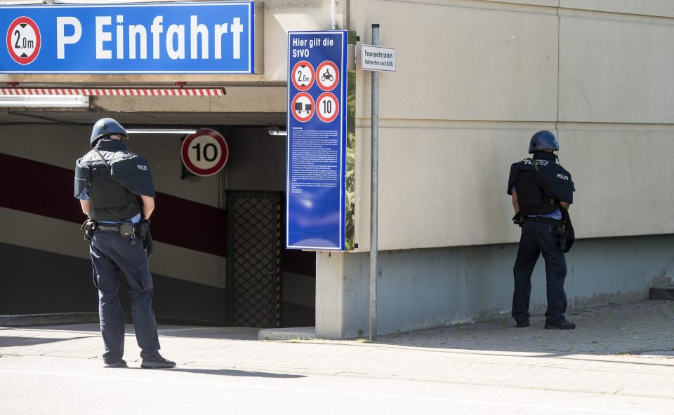 Up to 25 injured after masked gunman storms movie theatre and barricades himself in before being shot dead as police raid complex with tear gas