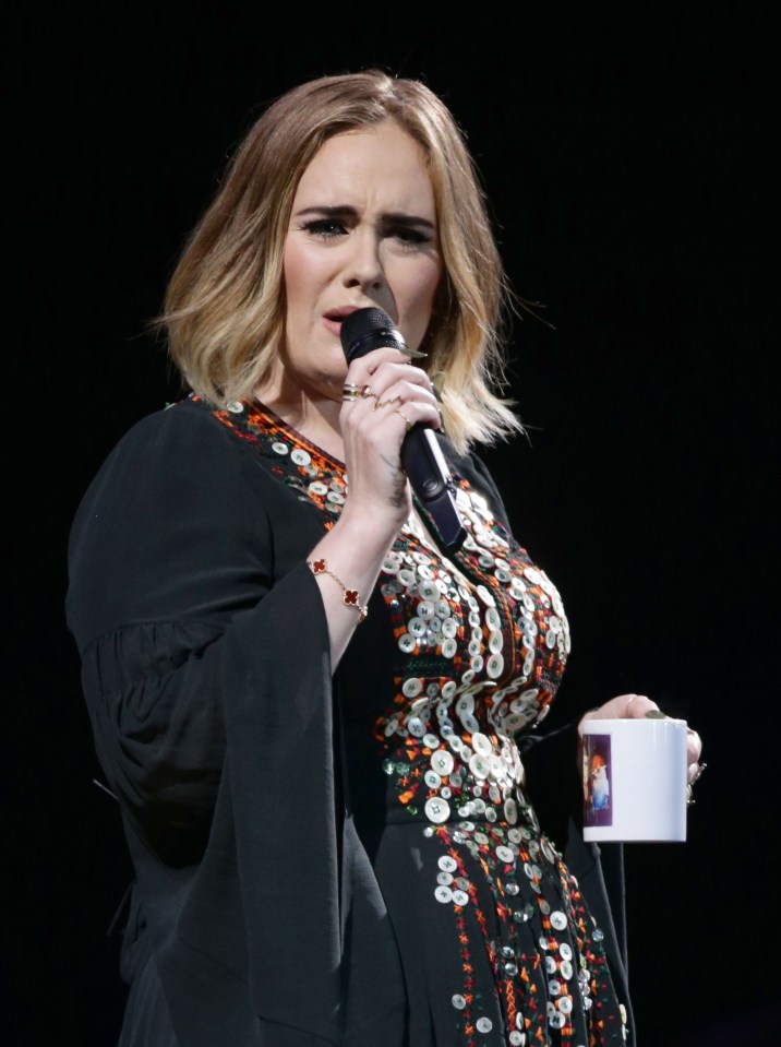 Adele took a mug on the stage perhaps to help her tackle her stage fright 