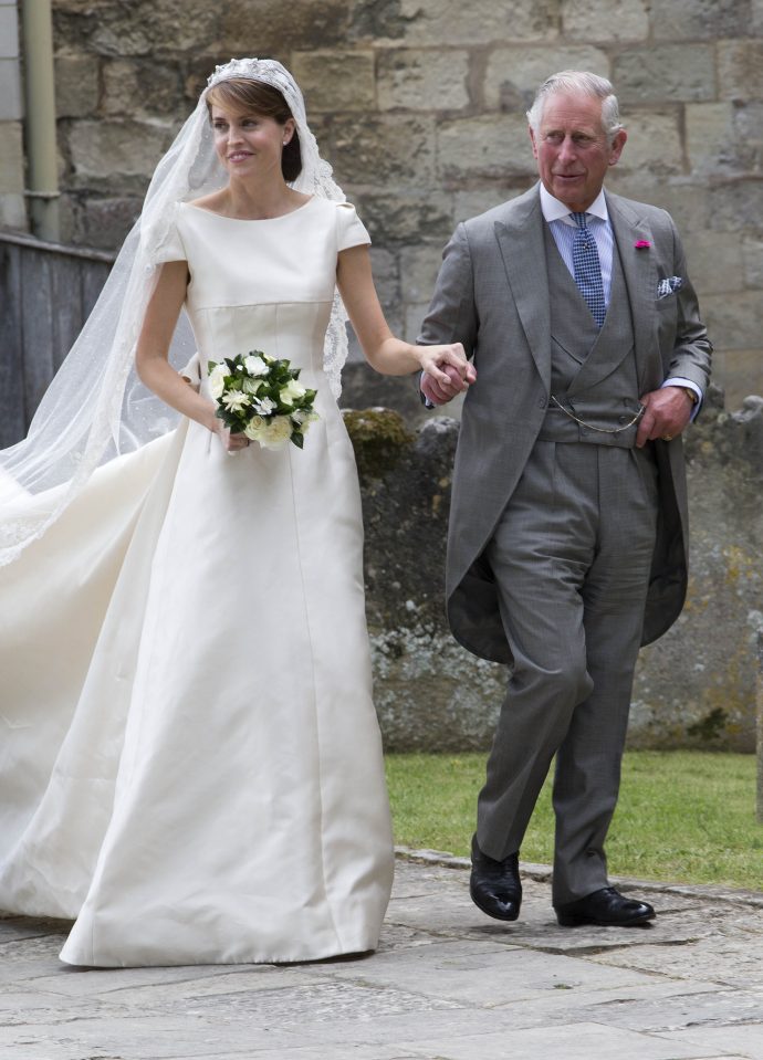 Prince Charles walks blushing bride Alexandra Knatchbull into the church