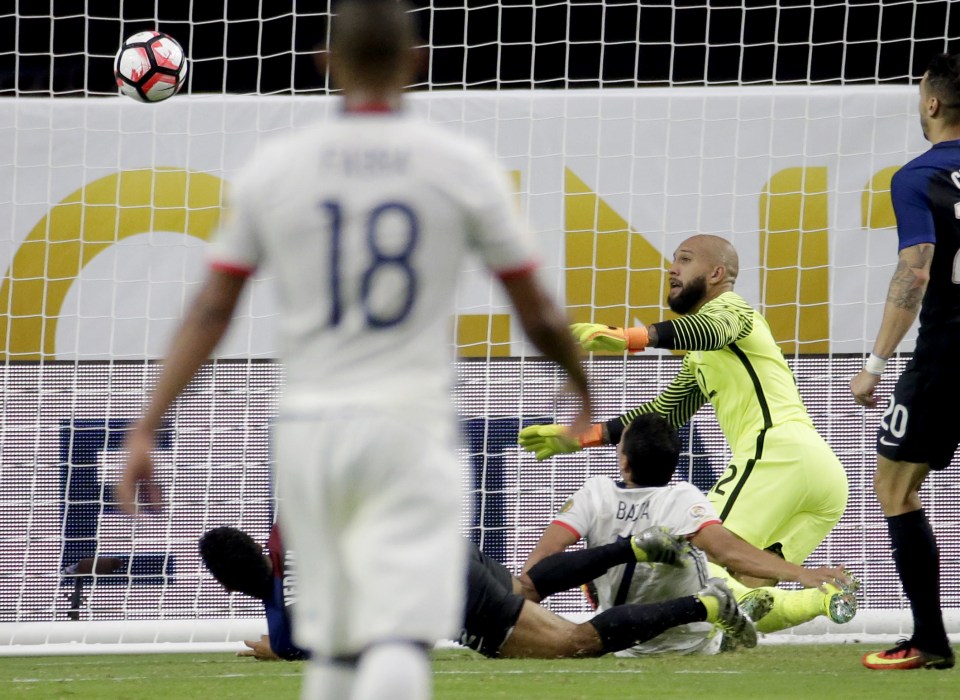 USA goalkeeper Tim Howard can only watch on as Bacca scores