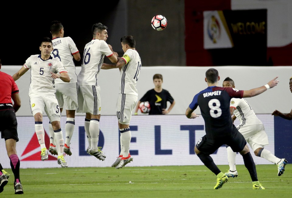 Clint Dempsey strikes a free-kick towards goal that was saved by David Ospina