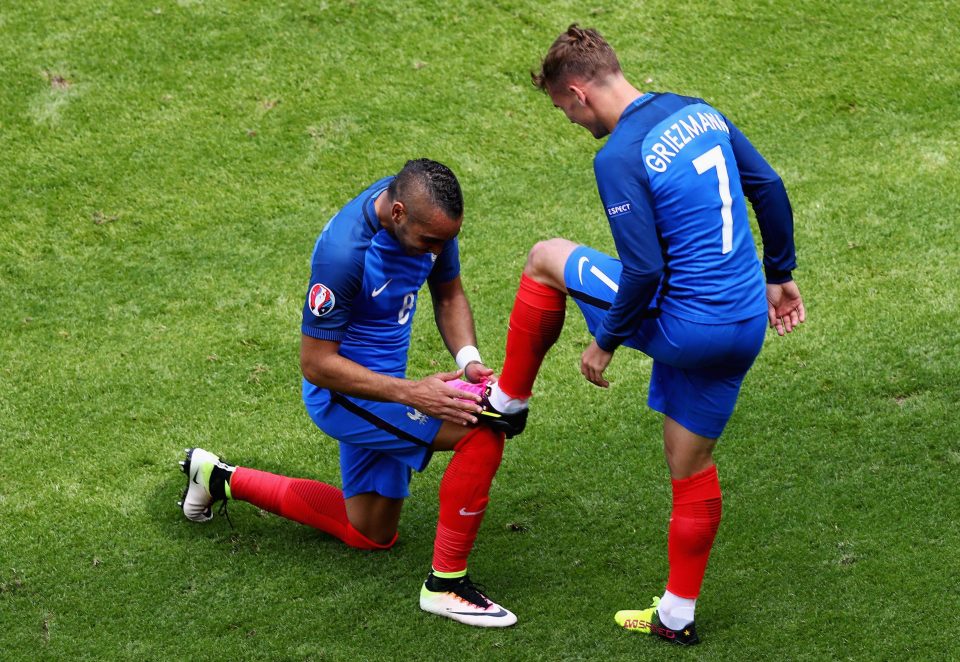 Dimitri Payet celebrates with match-winner Antoine Griezmann