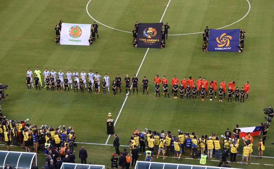 Both teams line up for the national anthem before kick-off in New Jersey