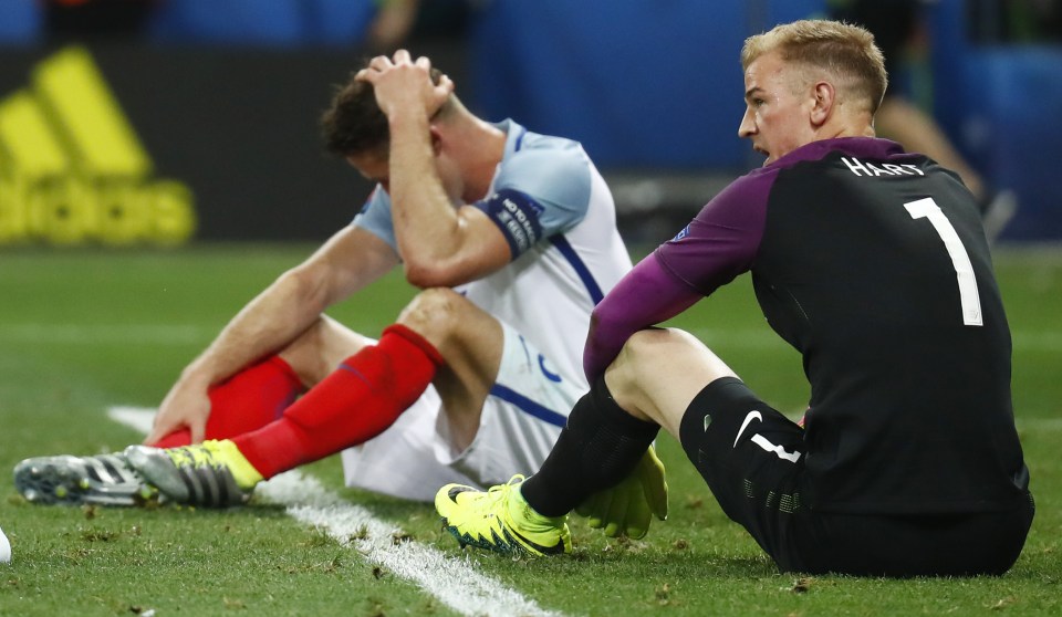 Gary Cahill and Joe Hart after the agonising defeat by Iceland