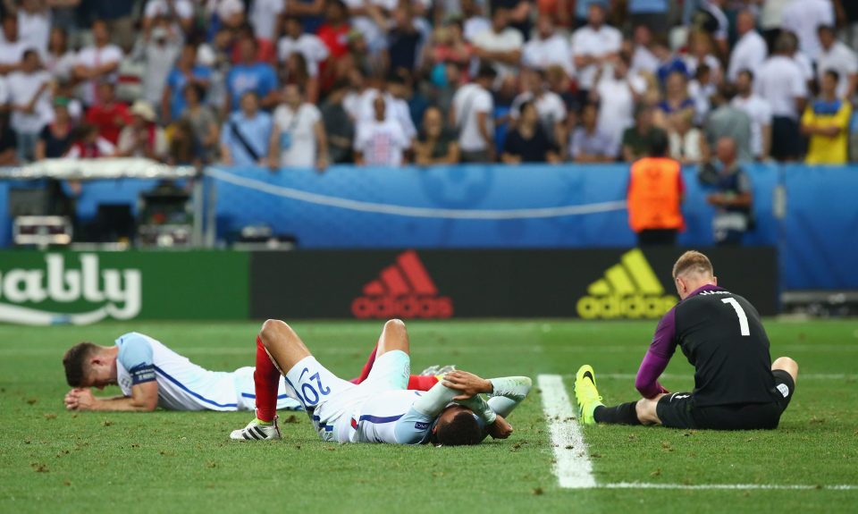 NICE, FRANCE - JUNE 27: (R to L) Joe Hart, Dele Alli and Gary Cahill of England show their dejection after their defeat in the UEFA EURO 2016 round of 16 match between England and Iceland at Allianz Riviera Stadium on June 27, 2016 in Nice, France. (Photo by Alex Livesey/Getty Images)