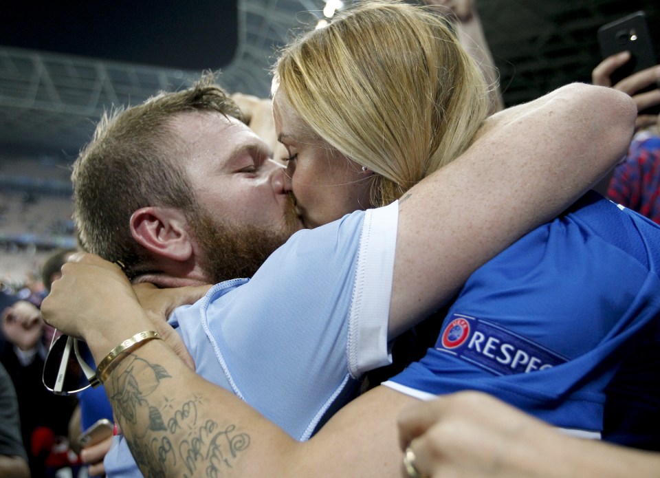 Iceland's Aron Gunnarsson gets a kiss at the end of the match