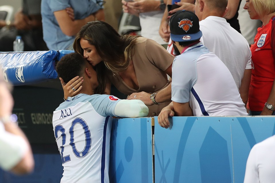 Kiss it better... Ruby Mae lands a smacker on Dele Alli after shocking defeat
