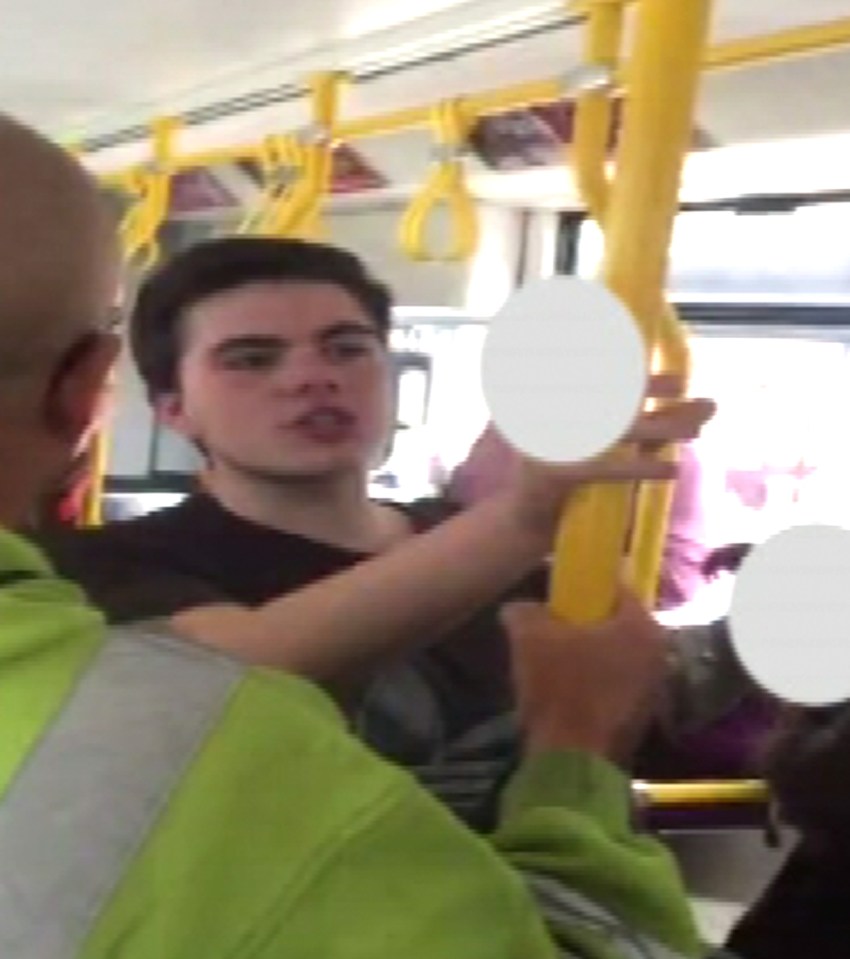 The vile thugs hurl a stream of racist abuse at a tram passenger who is seemingly minding his own business on the morning commute to work