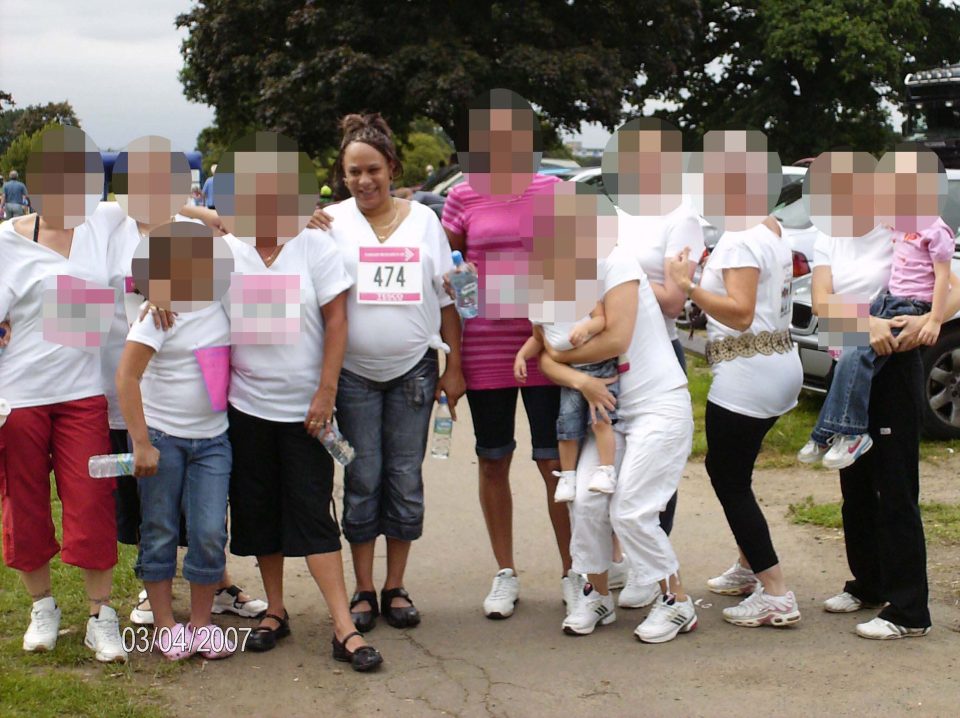 Michelle pictured with friends participating in a race for life before she had the spinal condition