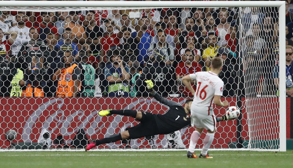 Portugal goalkeeper Rui Patricio saves Jakub Blaszczykowski's penalty 