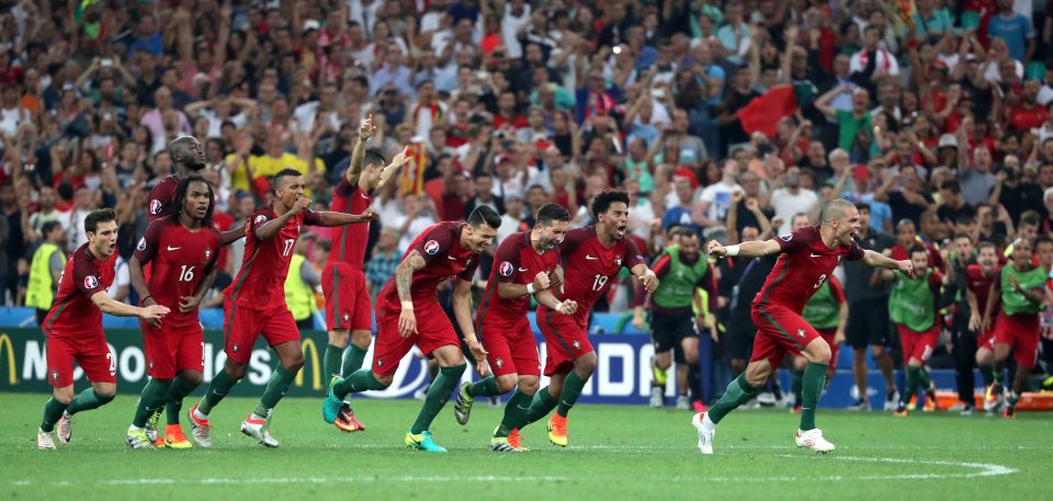 Portugal players celebrate after winning the shoot-out against Poland