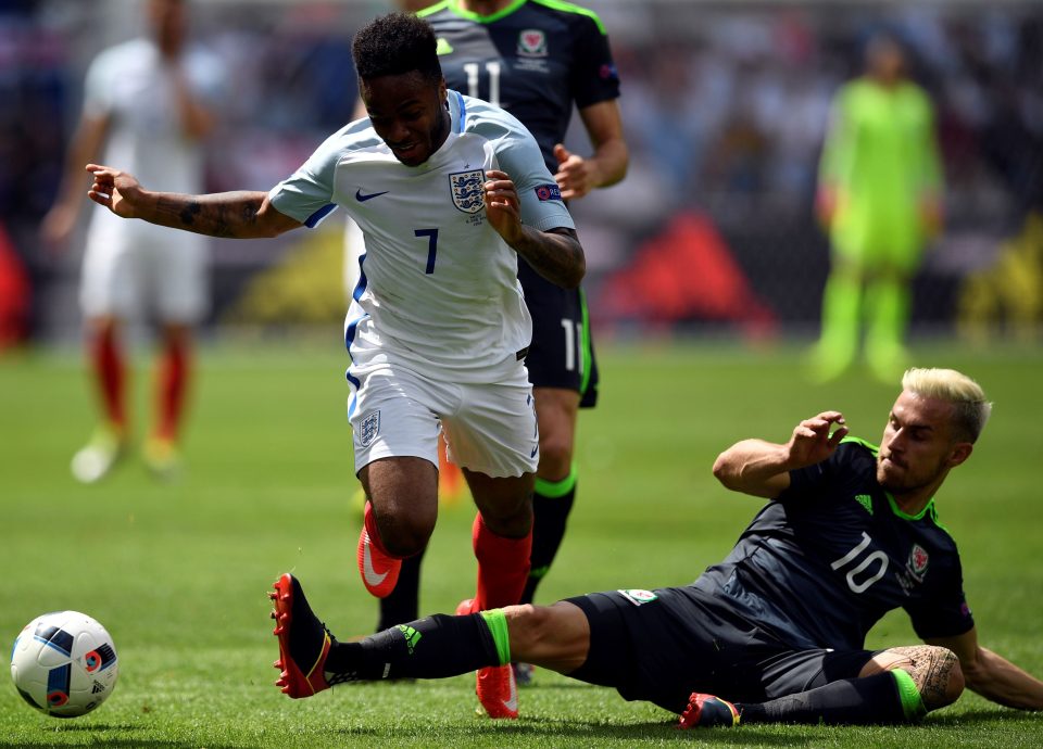 England attacker Raheem Sterling evades Wales' midfielder Aaron Ramsey