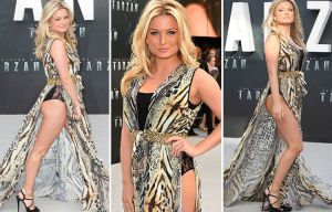 Zara Holland goes wild as she flashes her pants at Tarzan premiere