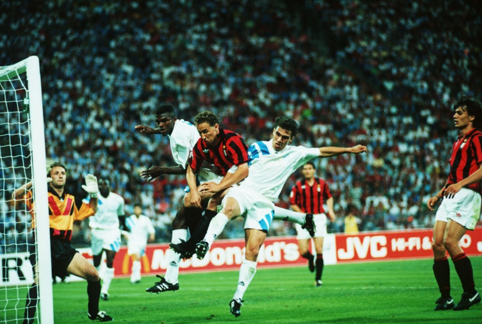 May 1993: Jean-Pierre Papin of Milan is challenged by marcel Desailly and Jean-Christophe Thomas of Marseille during the European Cup Final played between AC Milan and Marseille at the Olympic Stadium, Munich. Marseille won the match 1-0. Mandatory Credit: Shaun Botterill/Getty Images