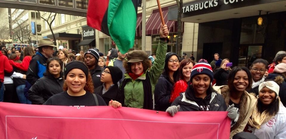 Rachel leading students in a peaceful activist march 2014