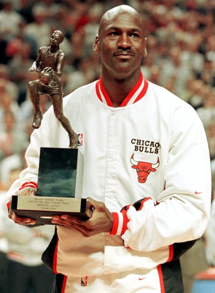 Jordan holds the Maurice Podoloff Most Valuable Player trophy