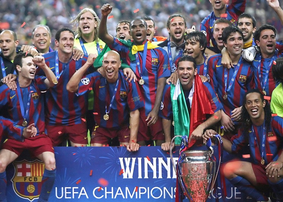 Arsenal v FC Barcelona (1-2); Barcelona's players celebrate with the trophy after winning the UEFA Champion's League final football match against. Arsenal, 17 May 2006 at the Stade de France in Saint-Denis, northern Paris. Barcelona won 2 to 1. AFP PHOTO LLUIS GENE(Photo credit should read LUIS GENE/AFP/Getty Images)