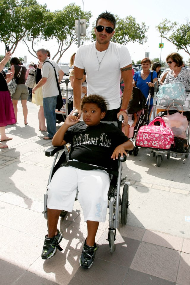 Peter pushes Harvey in his wheelchair in this picture taken in 2009