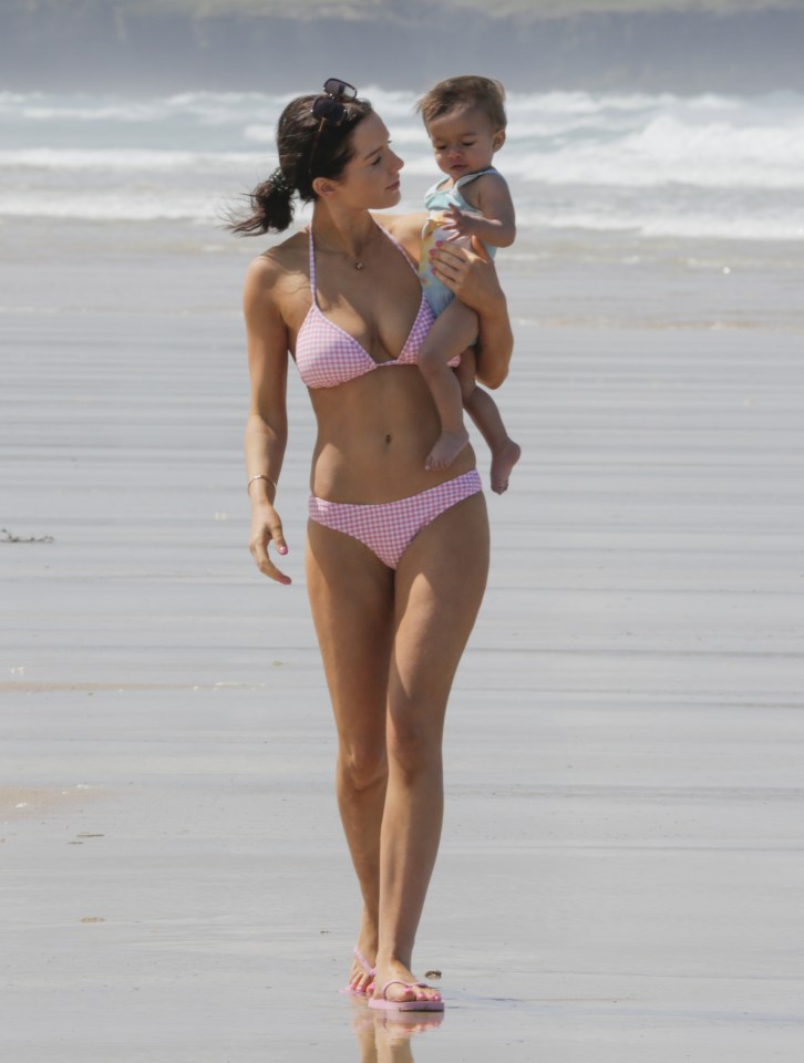 Helen Flanagan on the beach with daughter