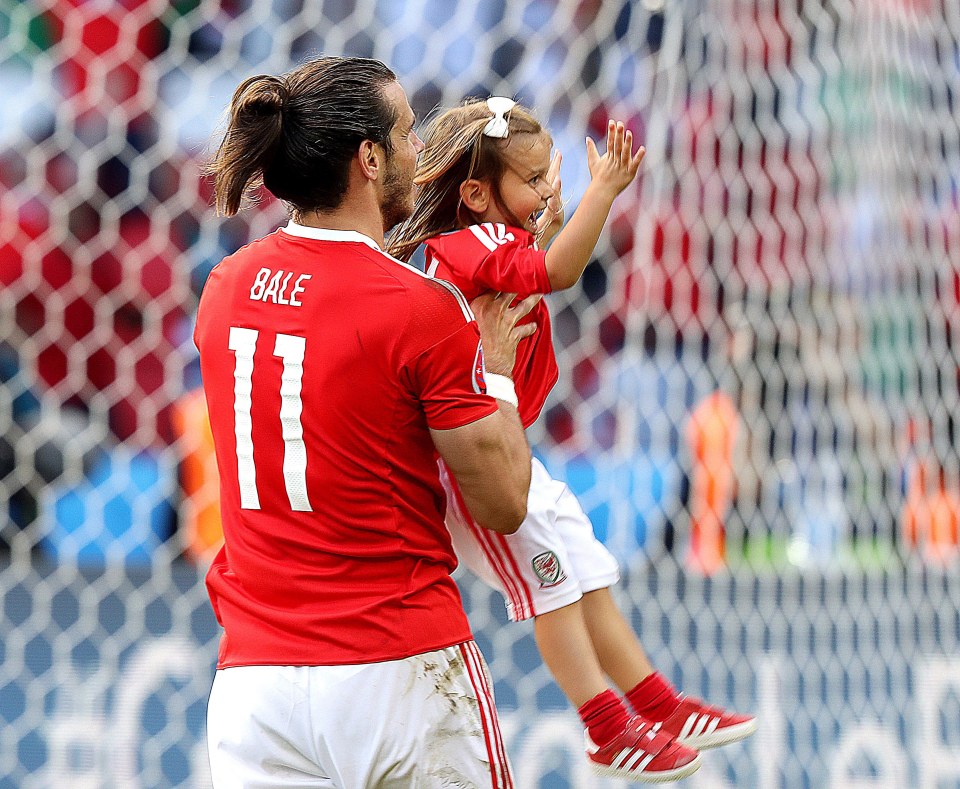 Welshman enjoyed an adorable stroll around the field with daugher Alba after beating Northern Ireland to set up quarter-final clash with belgium