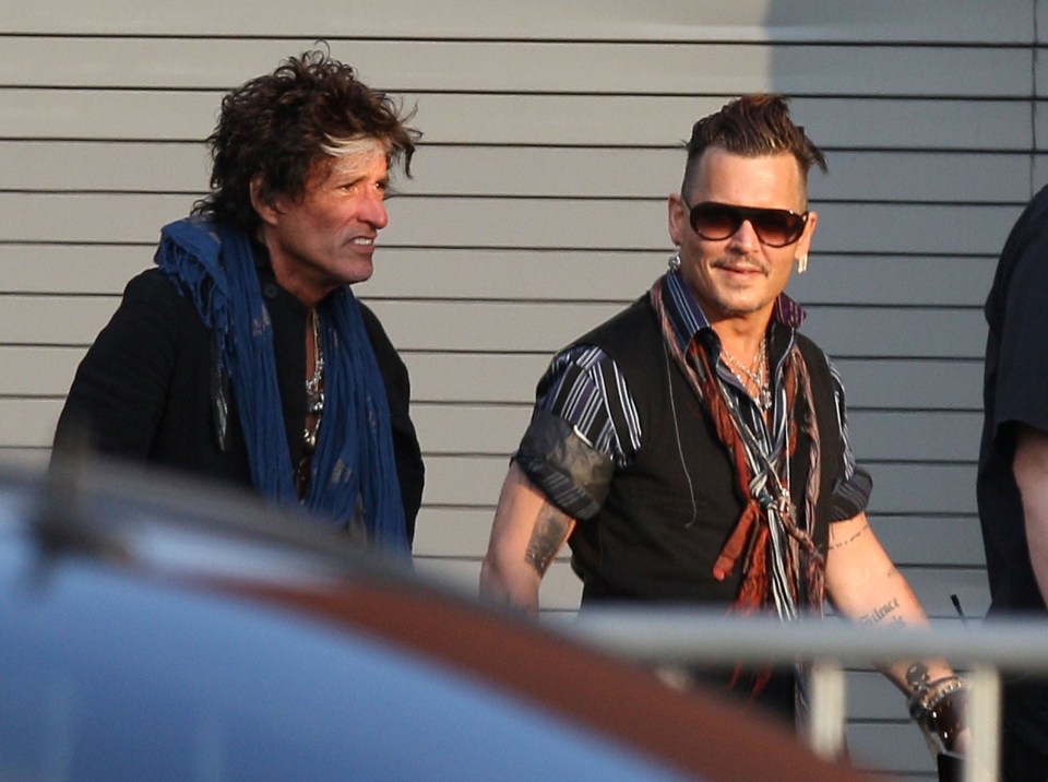 Johnny appears happier as he and band mate Joe Perry arrive for their concert at the Sands Casino