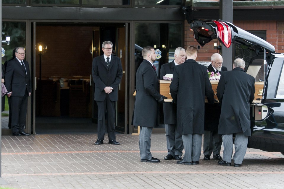 Loved ones of Rita King carry her coffin at the 81-year-old's funeral
