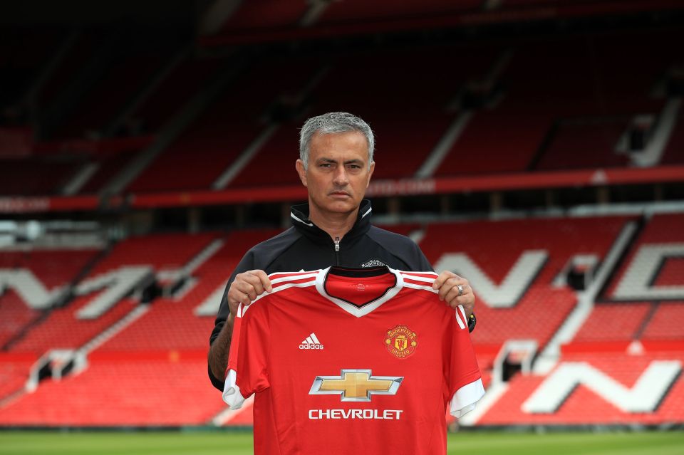 Jose Mourinho poses for a picture with the Manchester United shirt at Old Trafford