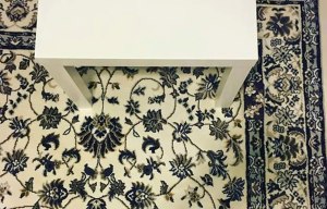 Now this is hard! Can you spot the mobile phone hidden on this rug