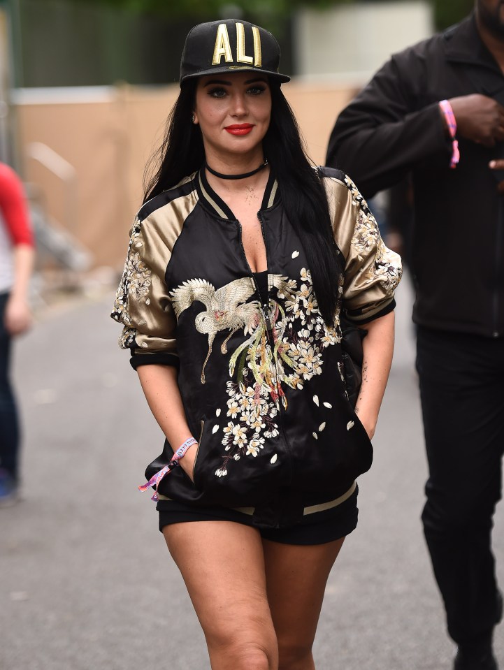 She teamed her outfit with a black baseball cap and a smile