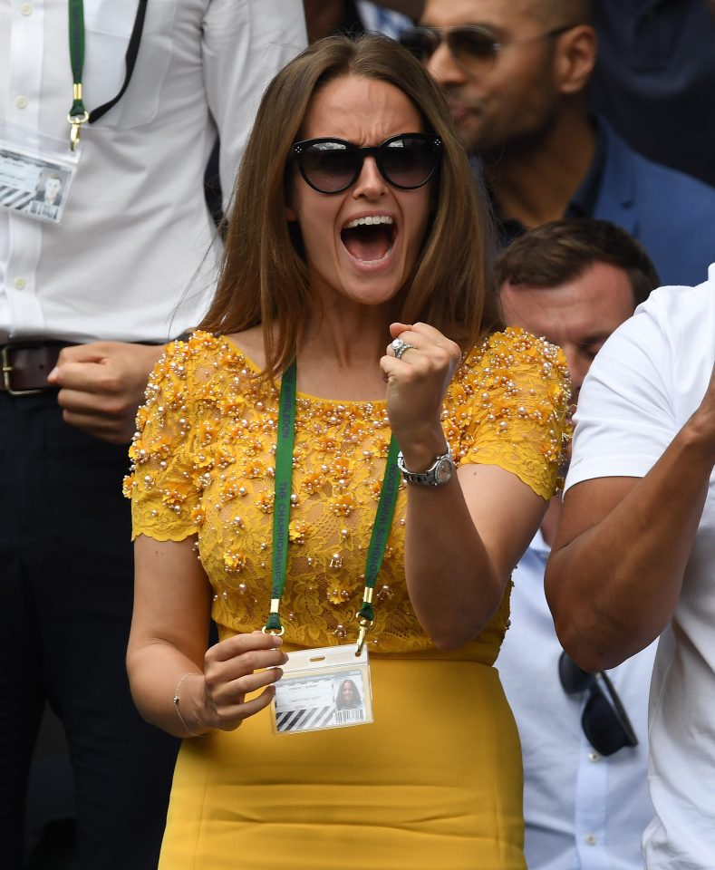 Kim cheered after her husband's straight sets victory