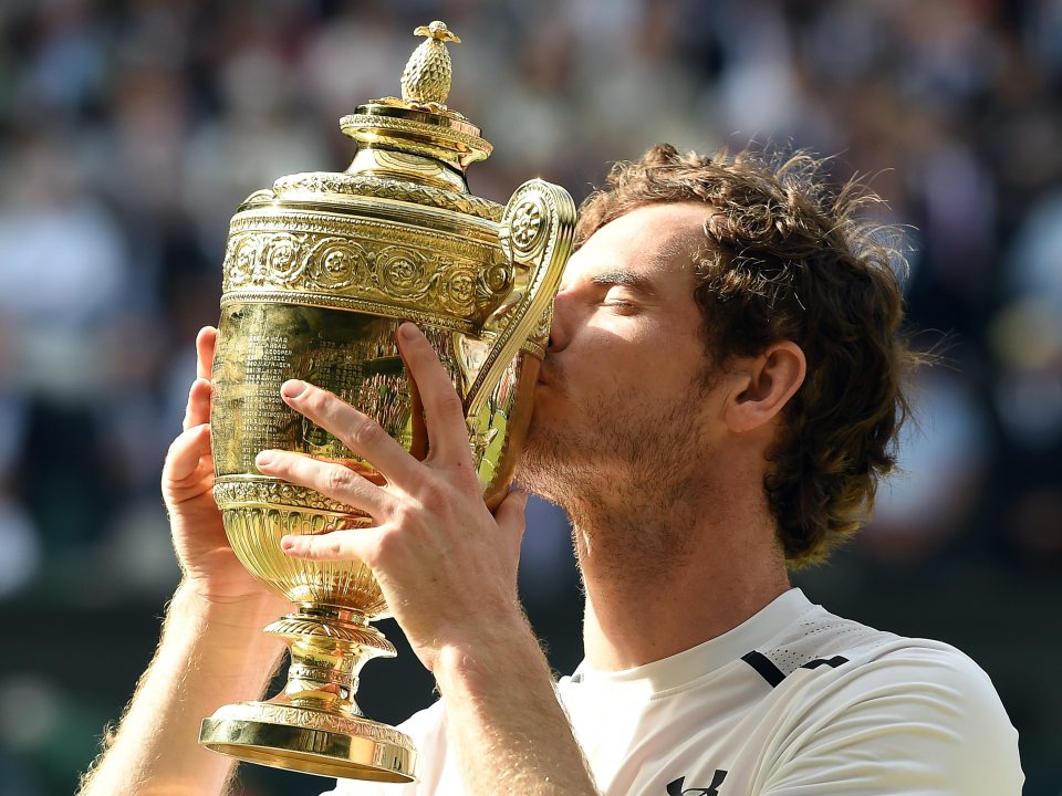 Murray kisses the trophy after his stunning victory over Raonic