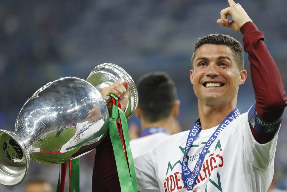 Portugal's Cristiano Ronaldo celebrates with the trophy