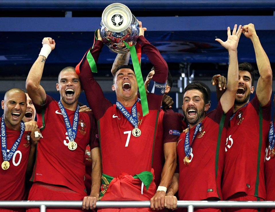 Cristiano Ronaldo of Portugal (c) lifts the Henri Delaunay trophy