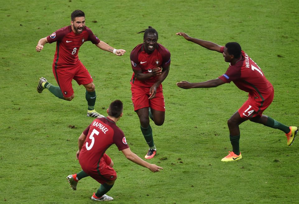 Portugal team-mates mob 109th minute match-winner Eder after he sunk France