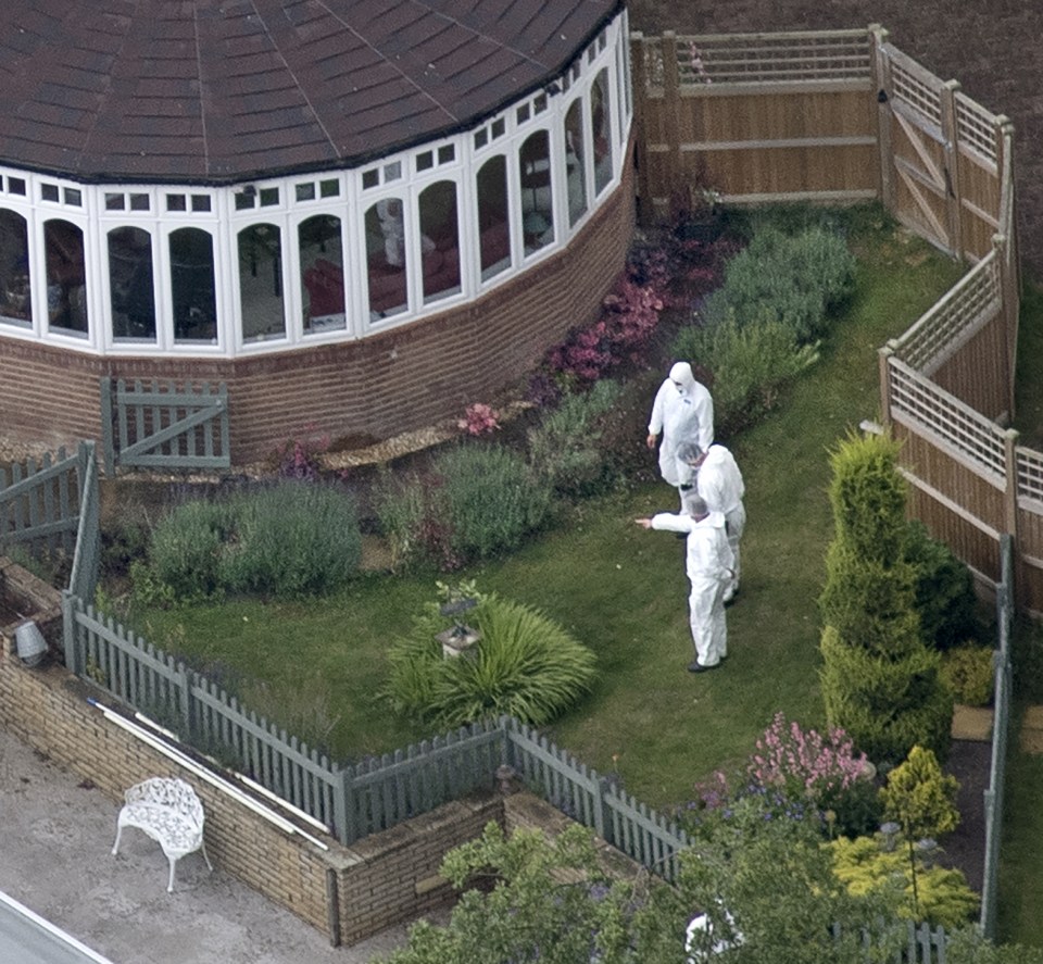 Forensic officers swarmed to the £1m home with police seen digging through the garden