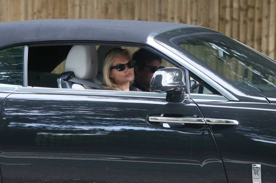 EXCLUSIVE ALL ROUNDER ***MINIMUM FEE £250 PER PICTURE APPLIES*** British supermodel Kate Moss gets her hands on another British supermodel, a brand new Rolls Royce Dawn. The convertible Dawn retails at £265,155.