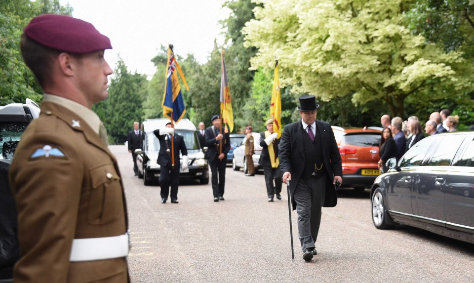 Hundreds of mourners lined the route to pay tribute to war hero Denis Icke, who died recently