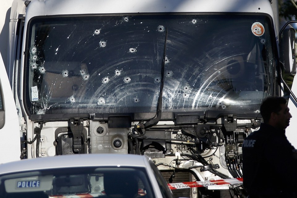 Police tried to bring the lorry to a halt. Its windscreen can be seen riddled with bullets following the rampage