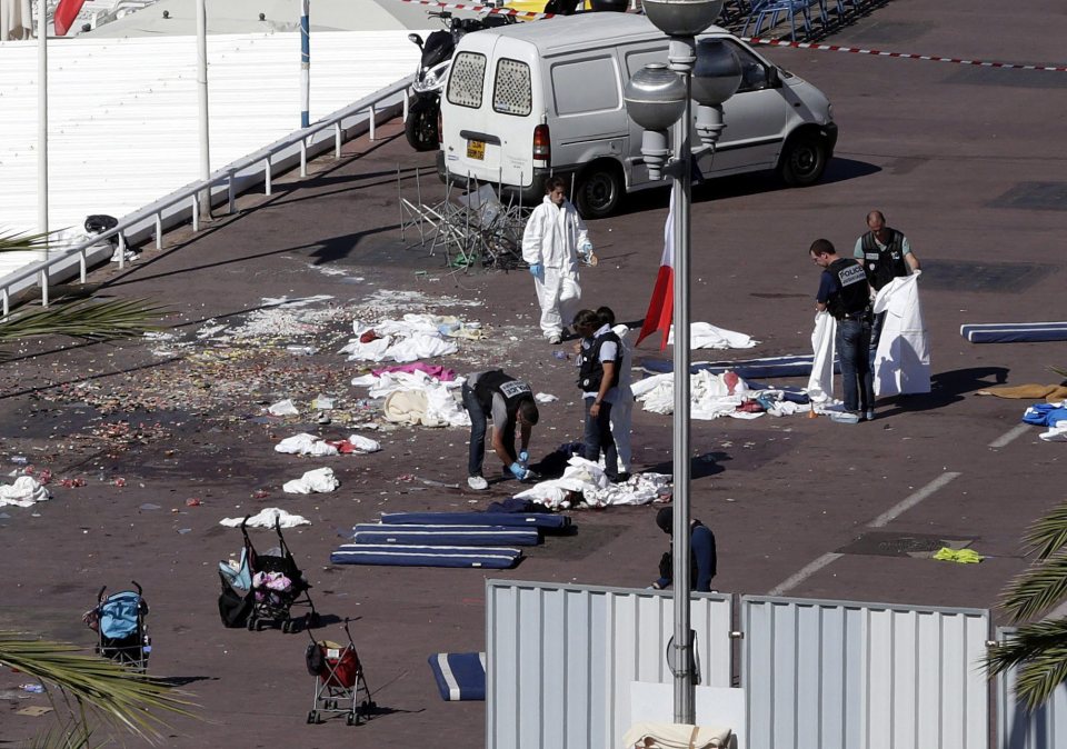 Abandoned pushchairs are left beside dead bodies in the aftermath of the attack