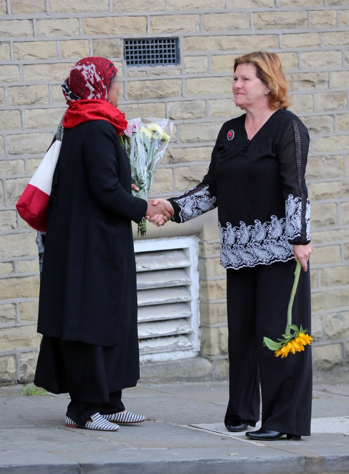 Friends comfort each other as they prepare to say goodbye to 41-year-old Jo