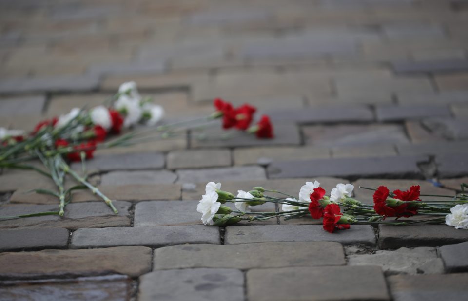 Flowers lay on the Yorkshire cobblestones after the funeral cortege of murdered member of parliament Jo Cox processed through Batley Market Place in her constituency